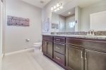Main bath with dual vanities and walk in shower 